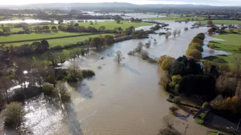 PA Media A view of floodwaters from the River Adur near Shermanbury in West Sussex