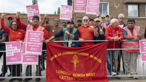 Getty Images Royal Mail postal workers go on strike in London on August 31