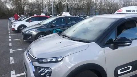 Driving instructors' cars lined up for protest