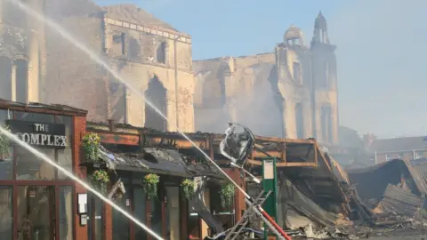 John Byford Complex building in aftermath of blaze