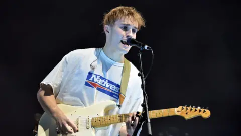 Getty Images Sam Fender on stage