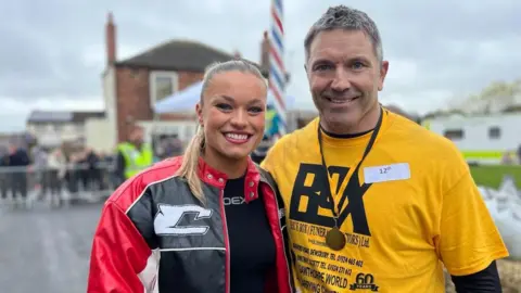 BBC/Olivia Richwald Gladiators star Jodie Ounsley with her father Phil