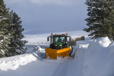 Getty Images A snow plough is seen clearing snow on 8 February 2021 in Cabrach, Scotland