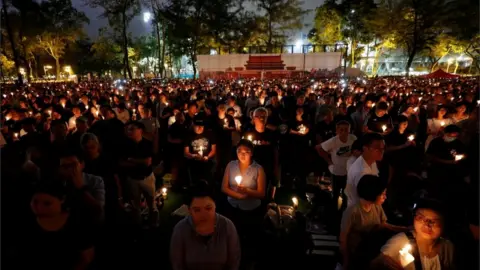 Reuters A candle light vigil for the anniversary of the Tiananmen Square massacre, 2019