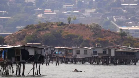 Reuters Stilt houses and apartment blocks in Port Moresby harbour