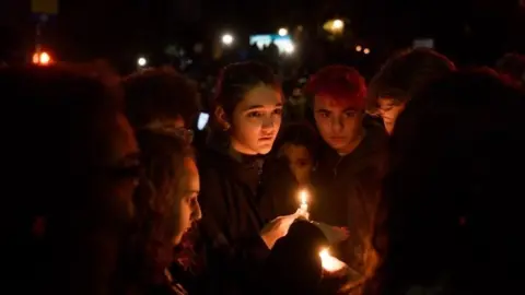 Getty Images People at a vigil in Pittsburgh's Squirrel Hill