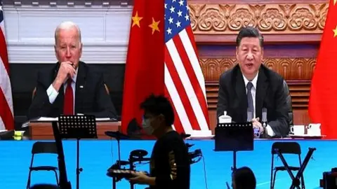 Reuters Virtual meeting between Joe Biden and Xi Jinping, seen from a restaurant in Beijing