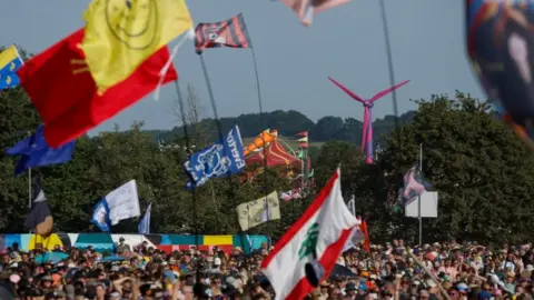 Reuters A large crowd at Glastonbury Festival
