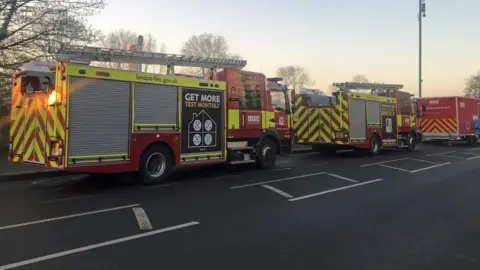 PA Media Fire engines at the scene of a fire in west London