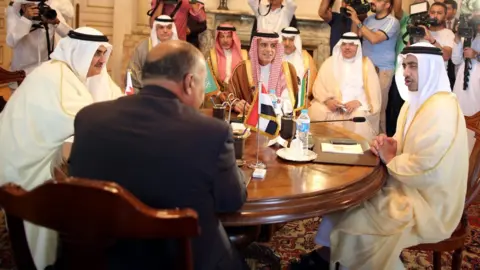 EPA Saudi Foreign Minister Adel al-Jubeir (C), UAE Foreign Minister Abdullah bin Zayed Al Nahyan (R), Egyptian Foreign Minister Sameh Shoukry (2-L), and Bahraini Foreign Minister Khalid bin Ahmed Al Khalifa (L) meet to discuss the diplomatic situation with Qatar, in Cairo, Egypt (5 July 2017)