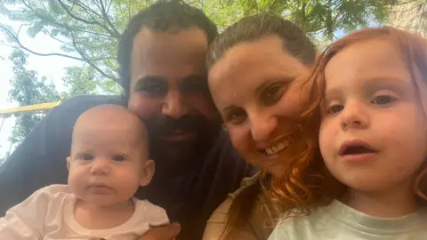 Family photo Shiri, her two children Ariel and Kfir, and her husband Yarden.