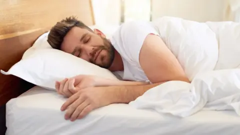 Getty Images A man sleeping in