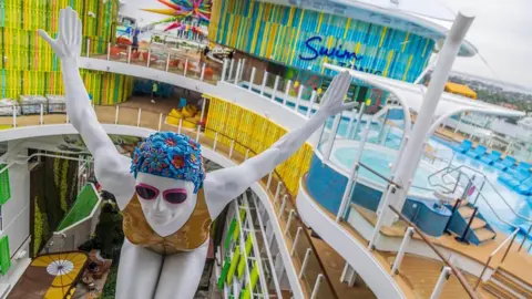 Getty Images View of a swimmer sculpture feature in the Chill Island deck on Royal Caribbean's Icon of the Seas, the world's largest cruise ship, docked at PortMiami a day after arrived to its home base in Miami for the first time, on Jan. 11, 2024