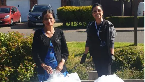 Kiran Dharni Volunteers in Bedfordshire with PPE materials