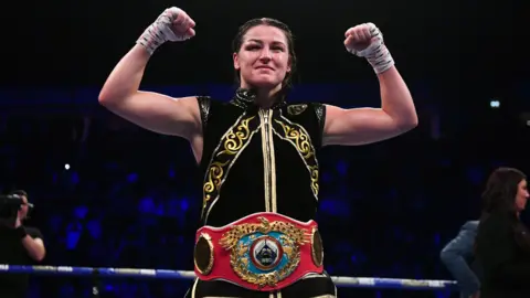 Irish boxer Katie Taylor celebrates after beating Christina Linardatou on points to win the WBO super-lightweight title