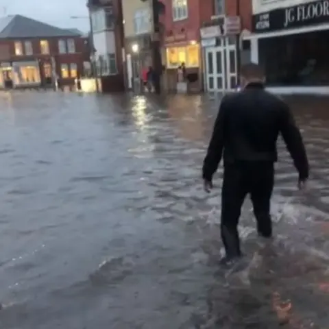 Paulina Atlas Person walking through flood water in Worksop