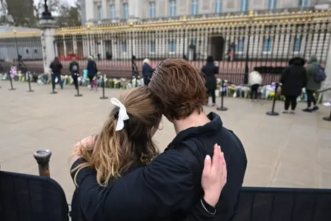 EPA people gather outside Buckingham Palace a day after the passing of Britain's Prince Philip in London. 10 April 2021.