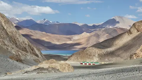 Getty Images Pangong Lake (Pangong Tso)(seen in the distance) in Ladakh, Jammu and Kashmir, India.