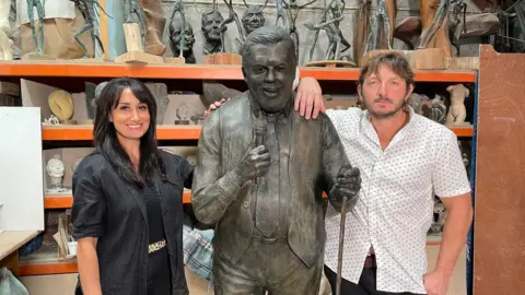 BBC Jesse and Stacey Rowe with the statue