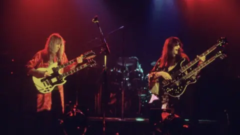 Hulton Archive/Getty Images Canadian rock band Rush take the stage fronted by guitarist Alex Liefson (left) with singer and bassist Geddy Lee