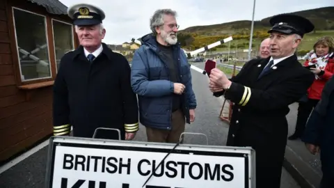 Getty Images Gerry Adams jokes with a fellow protester at Killeen