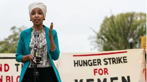 Getty Images Ilhan Omar at a rally in April 2021 to support a Hunger Strike for Yemen