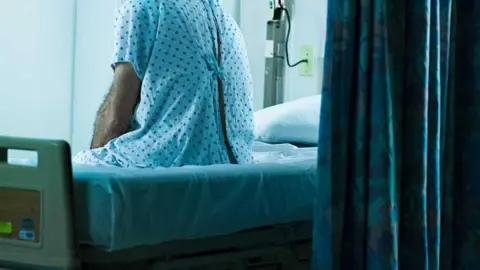 Getty Images A man on a hospital bed