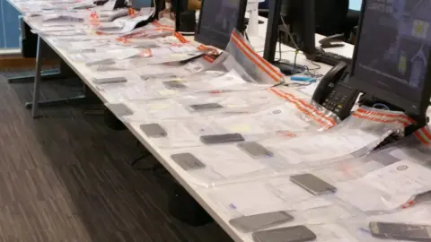 West Midlands Police Phones on table