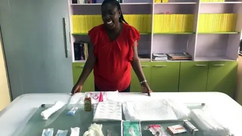 BBC Peju Jaiyeoba showing the contents of the Mother's Delivery Kit