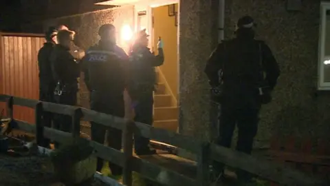 BBC Officers at a house in Glenfield where two bodies were found