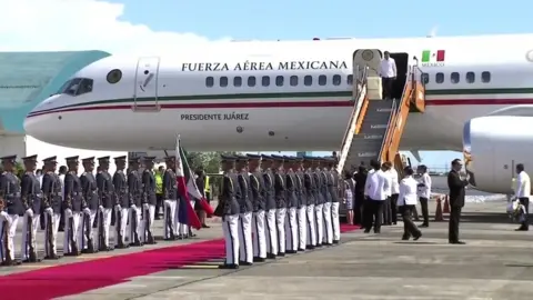 Reuters Mexico's President-elect Andrés Manuel López Obrador departs the commercial plane on Wednesday