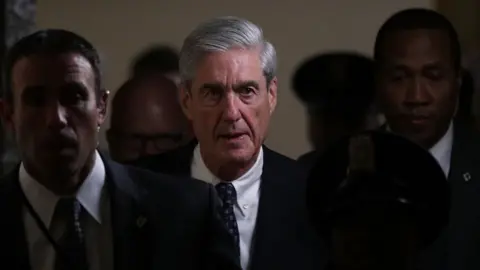 Getty Images Robert Mueller walks through the halls of Congress.