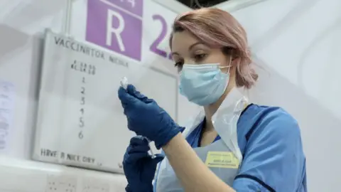 Getty Images nurse giving vaccine