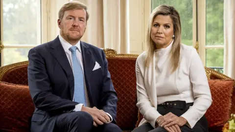 EPA Dutch King Willem-Alexander (L) and Queen Maxima look on during the recording of a personal video message in which the king discusses the cancellation of their holiday to Greece, in The Hague, The Netherlands, 21 October 2020.