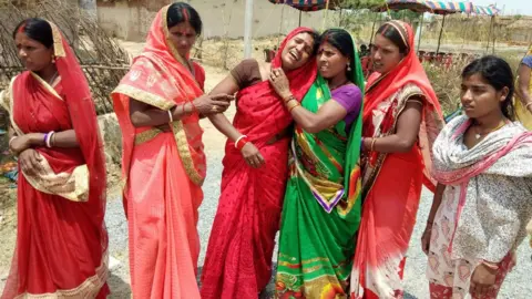 AFP Relatives mourn following the rape and murder of a 16-year-old girl in Raja Kundra village in the eastern Indian state of Jharkhand, on 5 May 2018.