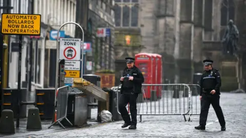 Getty Images police patrolling empty street