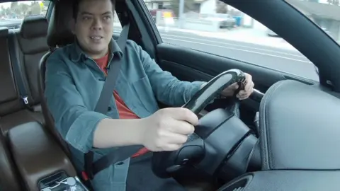 Nick Kwek drives a car he has hired via car-sharing app Turo
