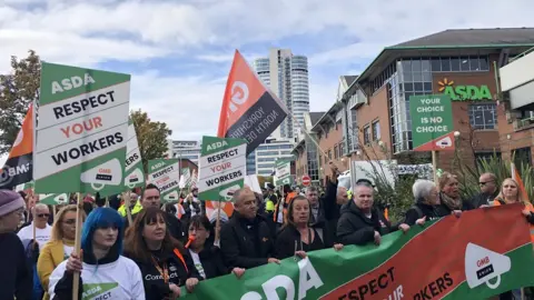 BBC Protesters outside Asda's headquarters in Leeds