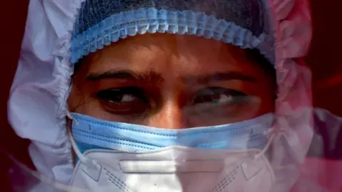 Getty Images A nurse wearing PPE