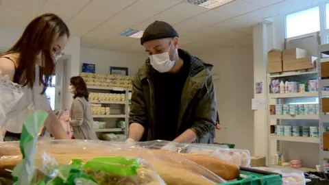 Volunteers inside a food bank at Montmartre