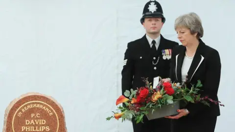PA Theresa May lays a wreath