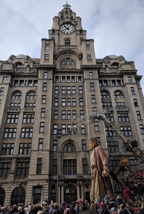 BBC giant strides in front of Liver Bird building