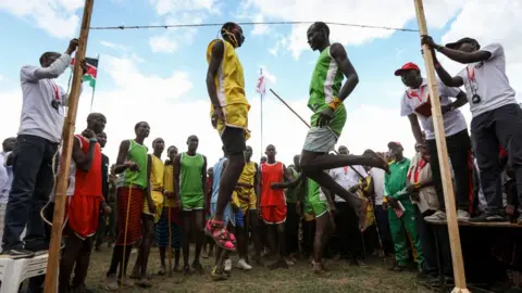 EPA Maasai Warriors compete in a traditional high-jump competition