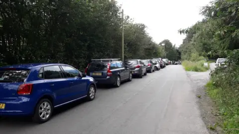 Clwydian Range and Dee Valley AONB Cars parked at the side of the road near Moel Famau