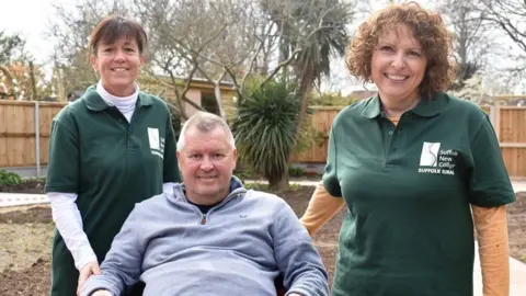 Suffolk Rural College Zibby Parker (left), Adrian Waterhouse-Taylor and Nicky O’Brien, in a Felixstowe garden before it had a makeover