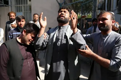 EPA Brother of a female doctor Sadaf, who was killed in a roadside bomb blast, reacts as he waits to receive her body at a hospital, in Jalalabad, Afghanistan, 04 March 2021.