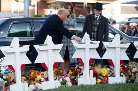 Getty Images Mr Trump and the first lady visited the scene of the massacre on Tuesday
