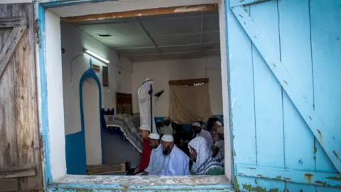 BBC/Shiraaz Mohamed Muslims in a mosque in Fort Dauphin, Madagascar