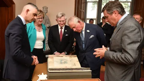 Getty Images Prince Charles inspects the Great Book of Ireland at University College Cork