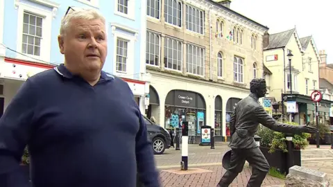 Emyr Thomas with Stanley statue in background